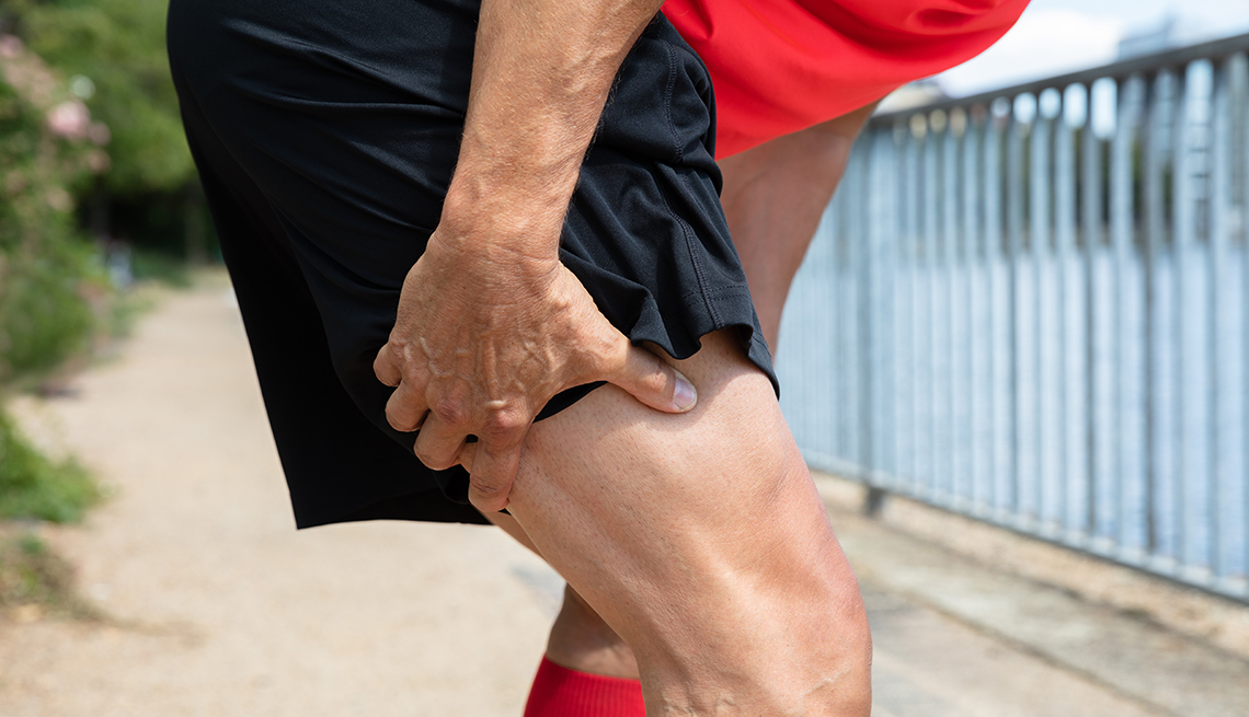 Man holding the back of his sore knee